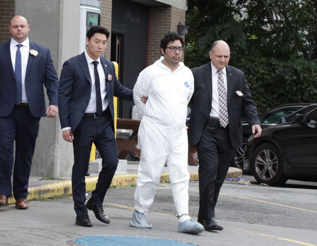 Suspect Peter Zisopoulos in custody, escorted by police.