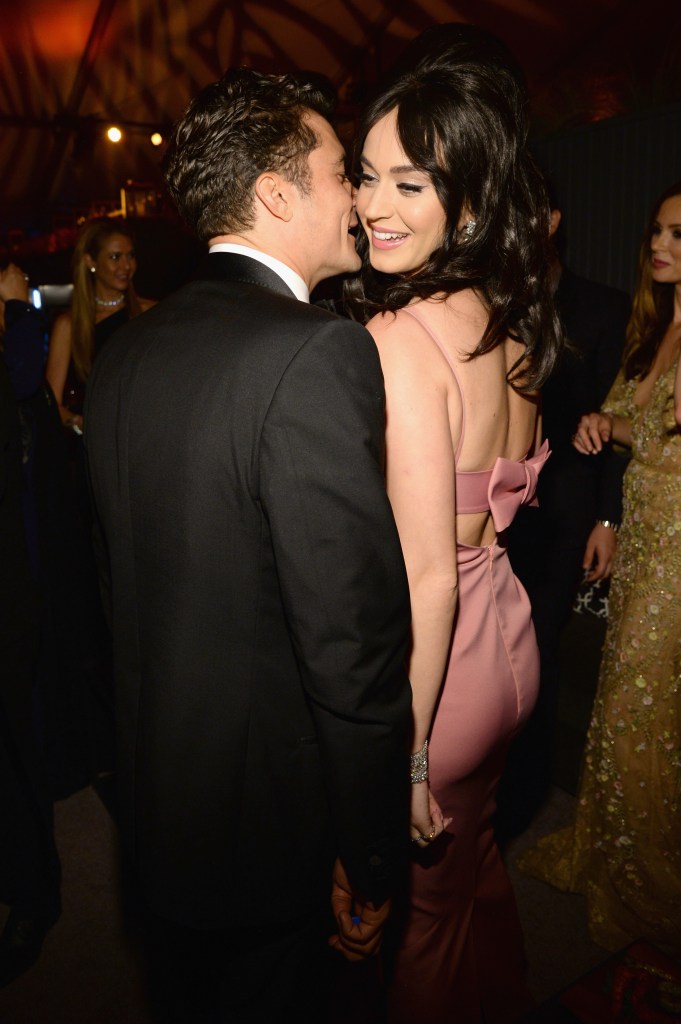Katy Perry and Orlando Bloom holding hands.