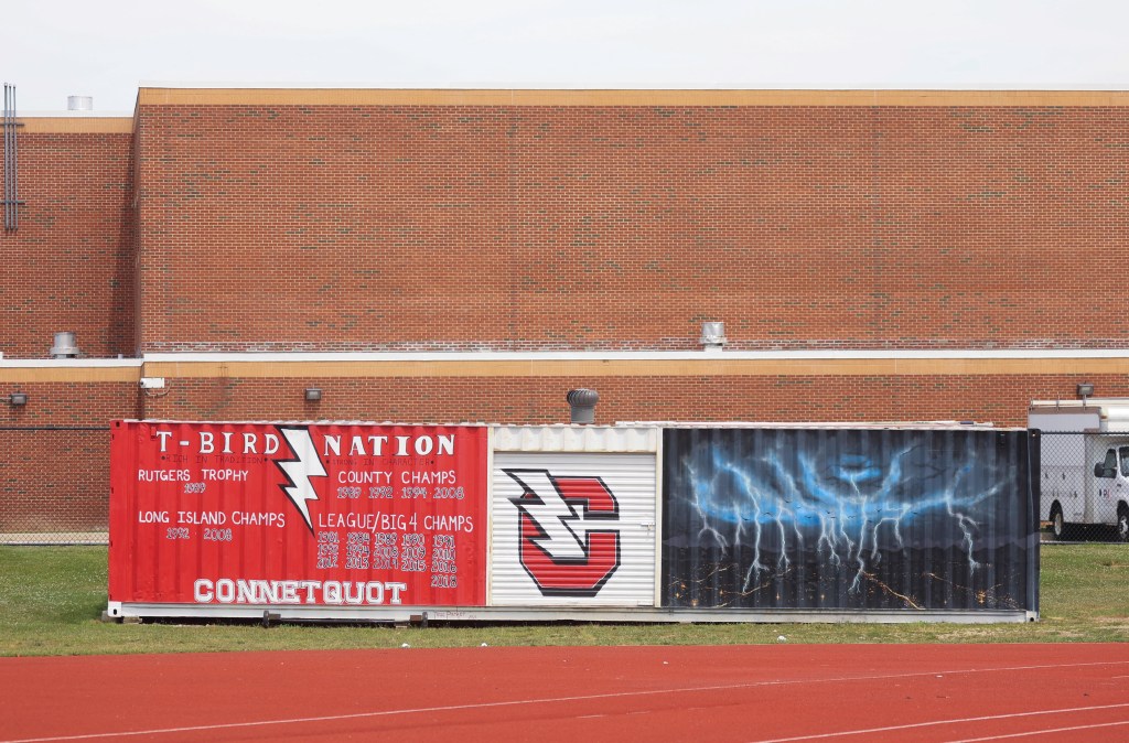 Connetquot High School T-Birds athletic achievements painted on shipping containers.