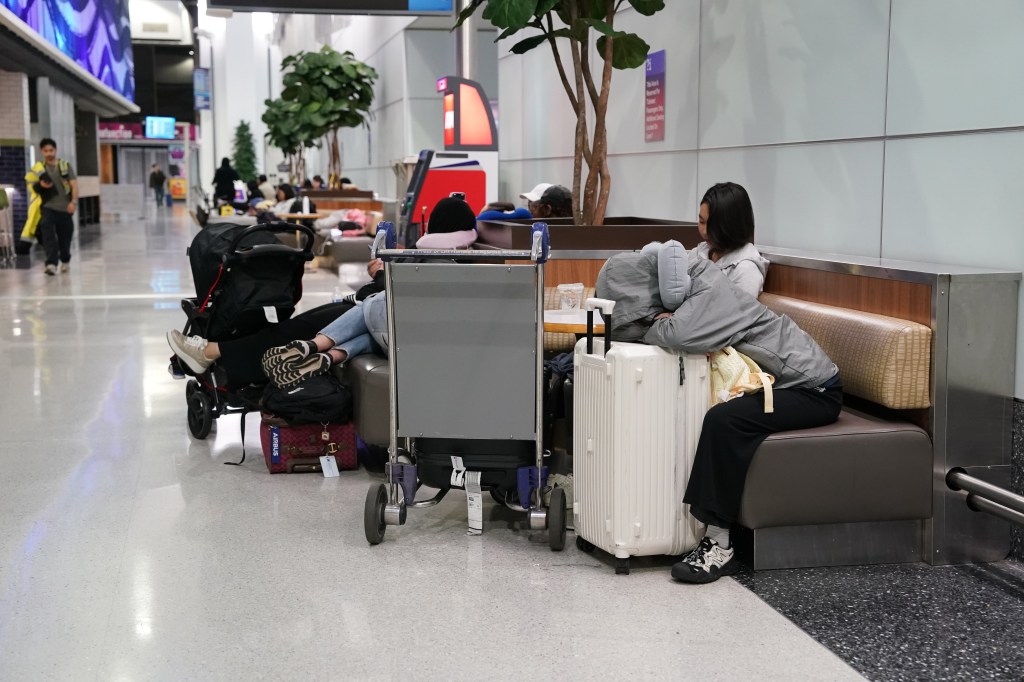 Stranded passengers resting at Newark Liberty International Airport.