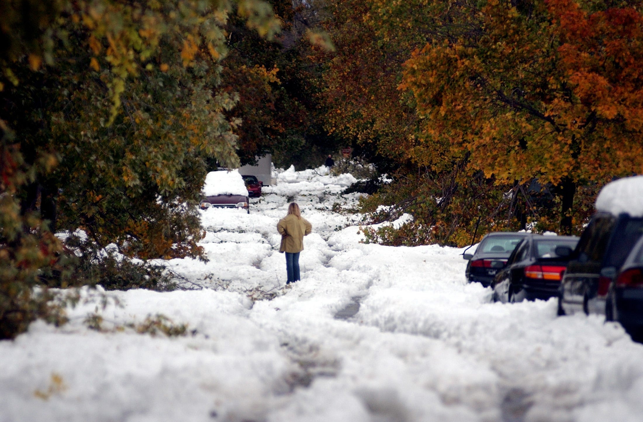 Chris Adamski stands in the middle of South Ellington Street after an unprecedented storm, in Depew, New York, October 13, 2006.