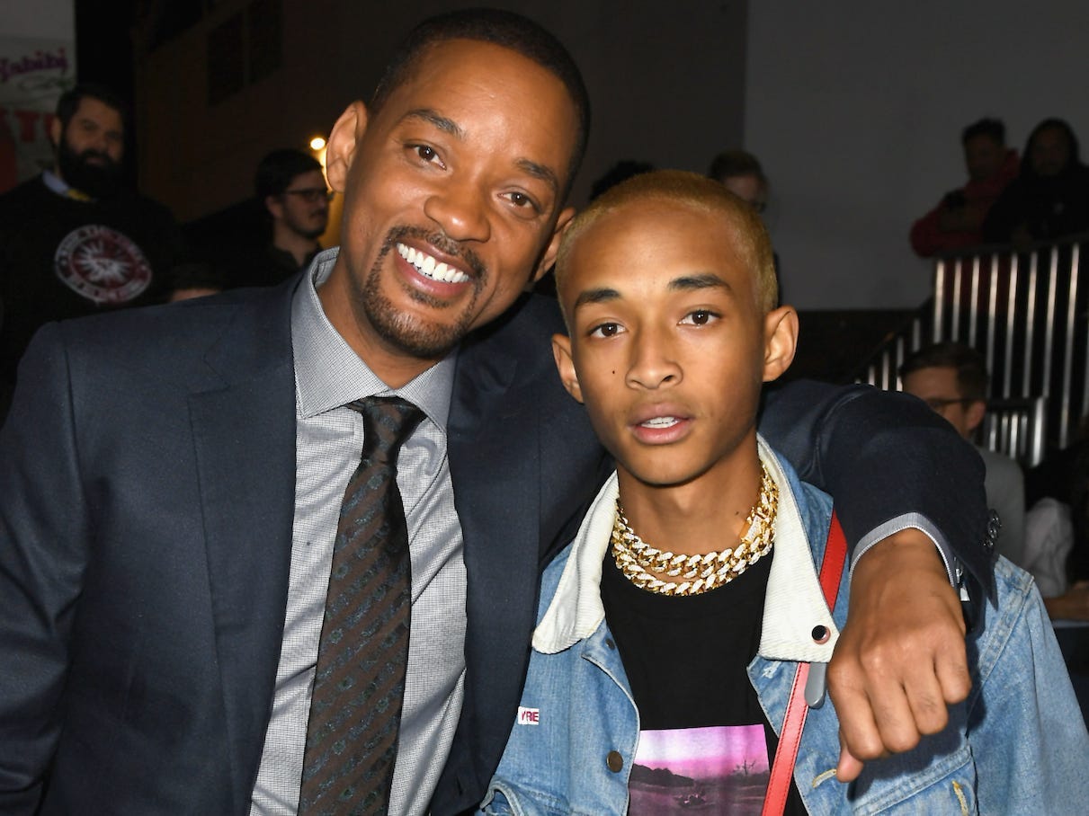 Will Smith and Jaden Smith embrace on a red carpet in December 2017.