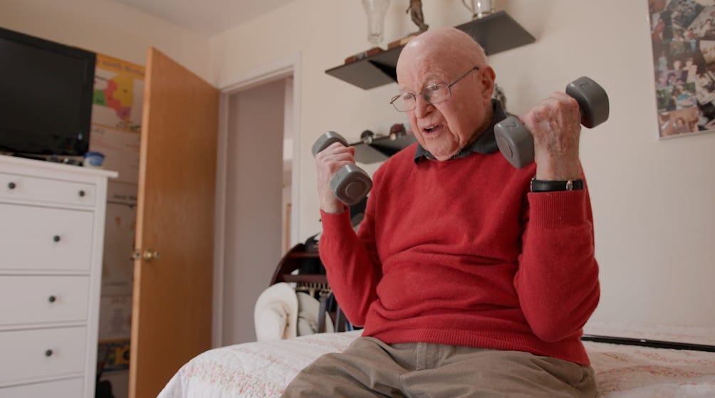 Jack Weber exercises with light weights.