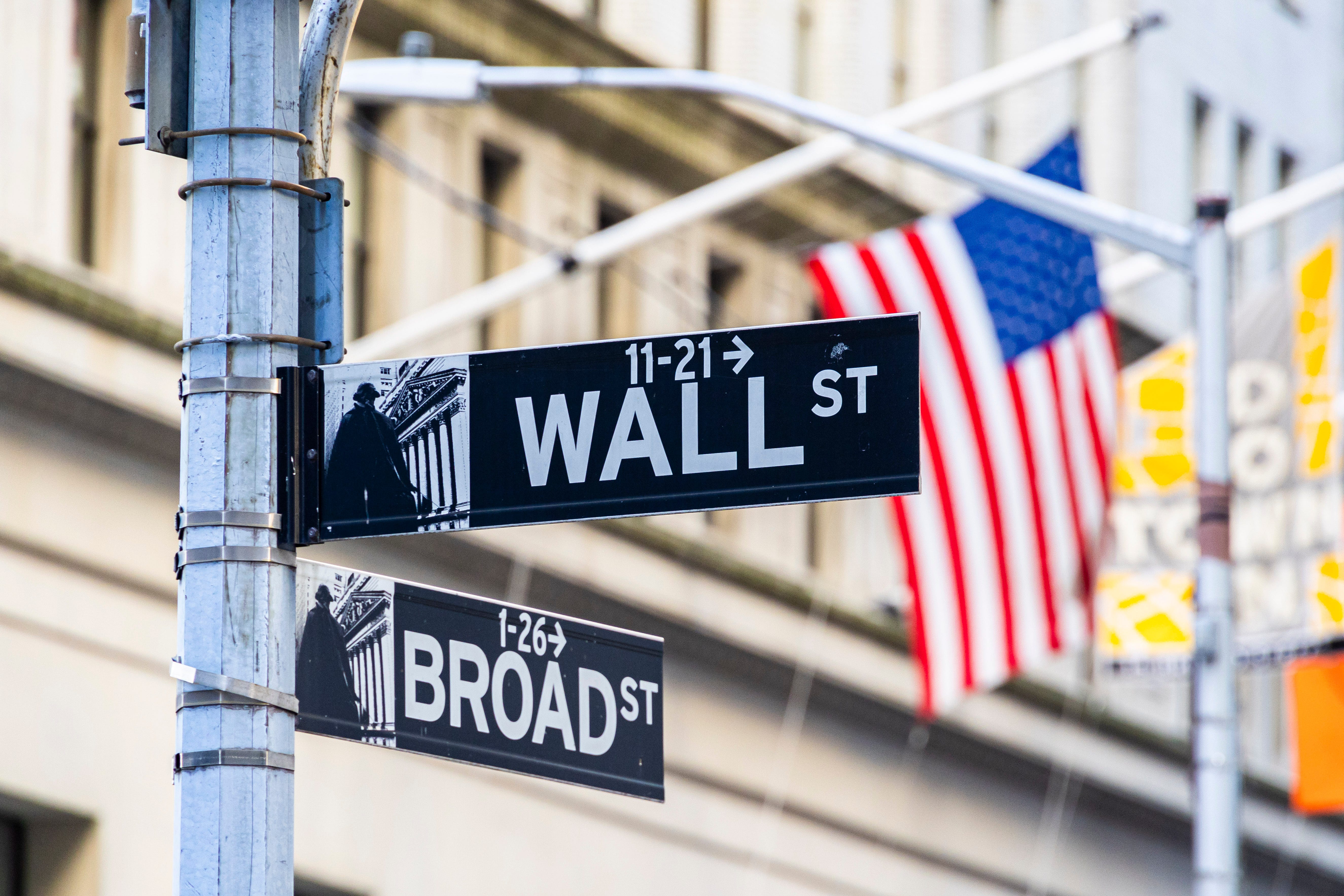 A street sign labelled "Wall Street" in lower Manhattan.