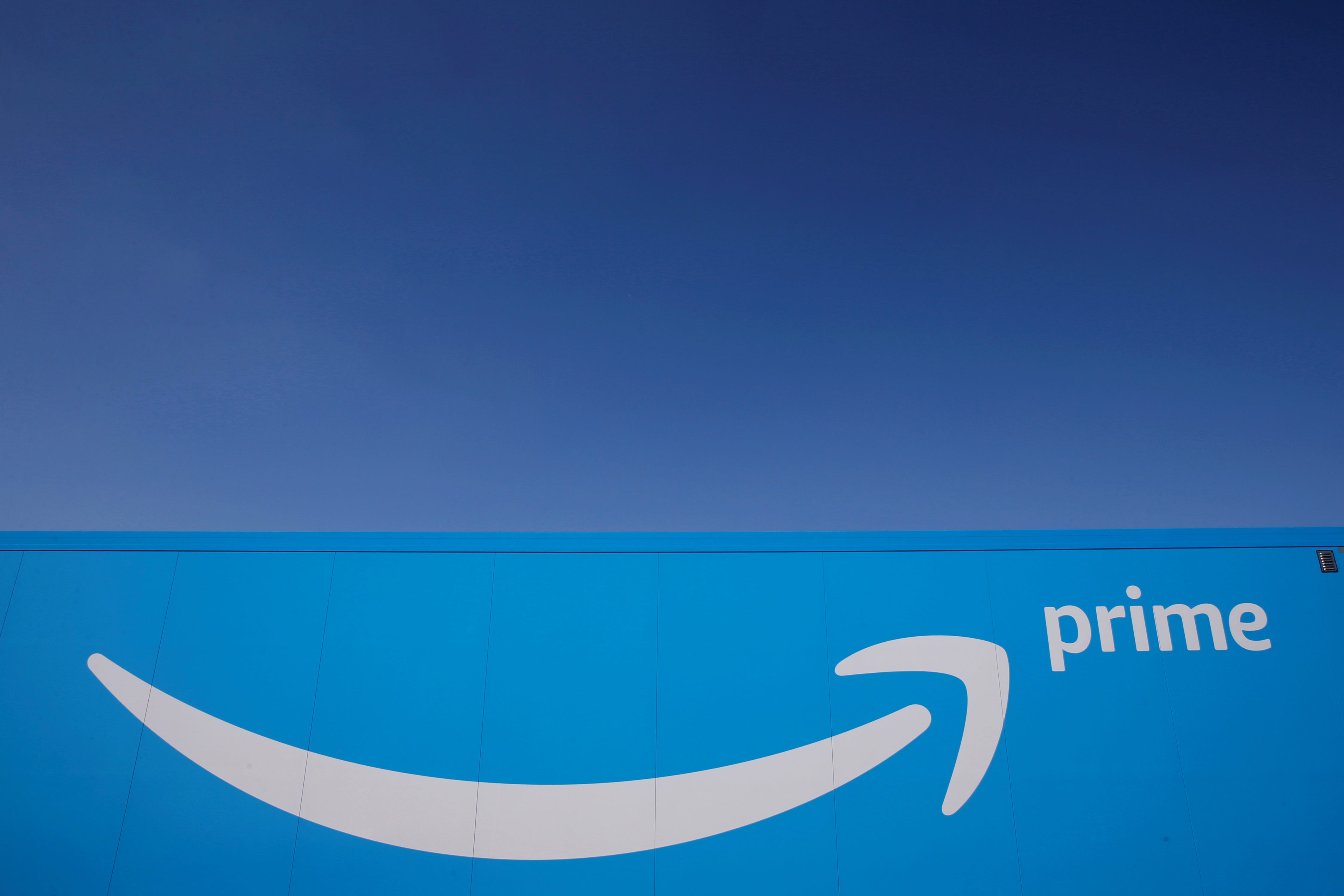 FILE PHOTO: The logo of Amazon Prime Delivery is seen on the trailer of a truck outside the company logistics centre in Boves, France, September 18, 2019. REUTERS/Pascal Rossignol
