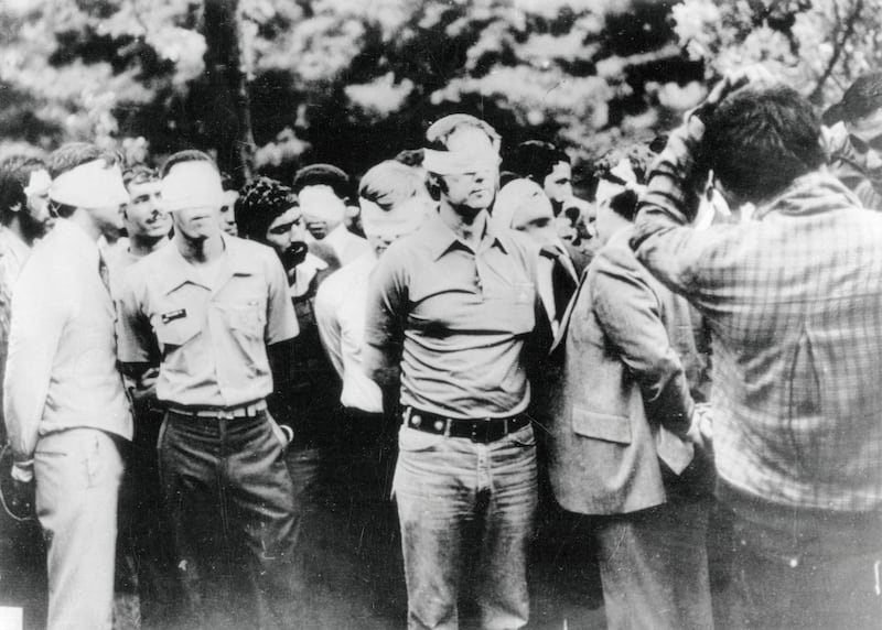 Americans blindfolded on first day of Iran crisis.