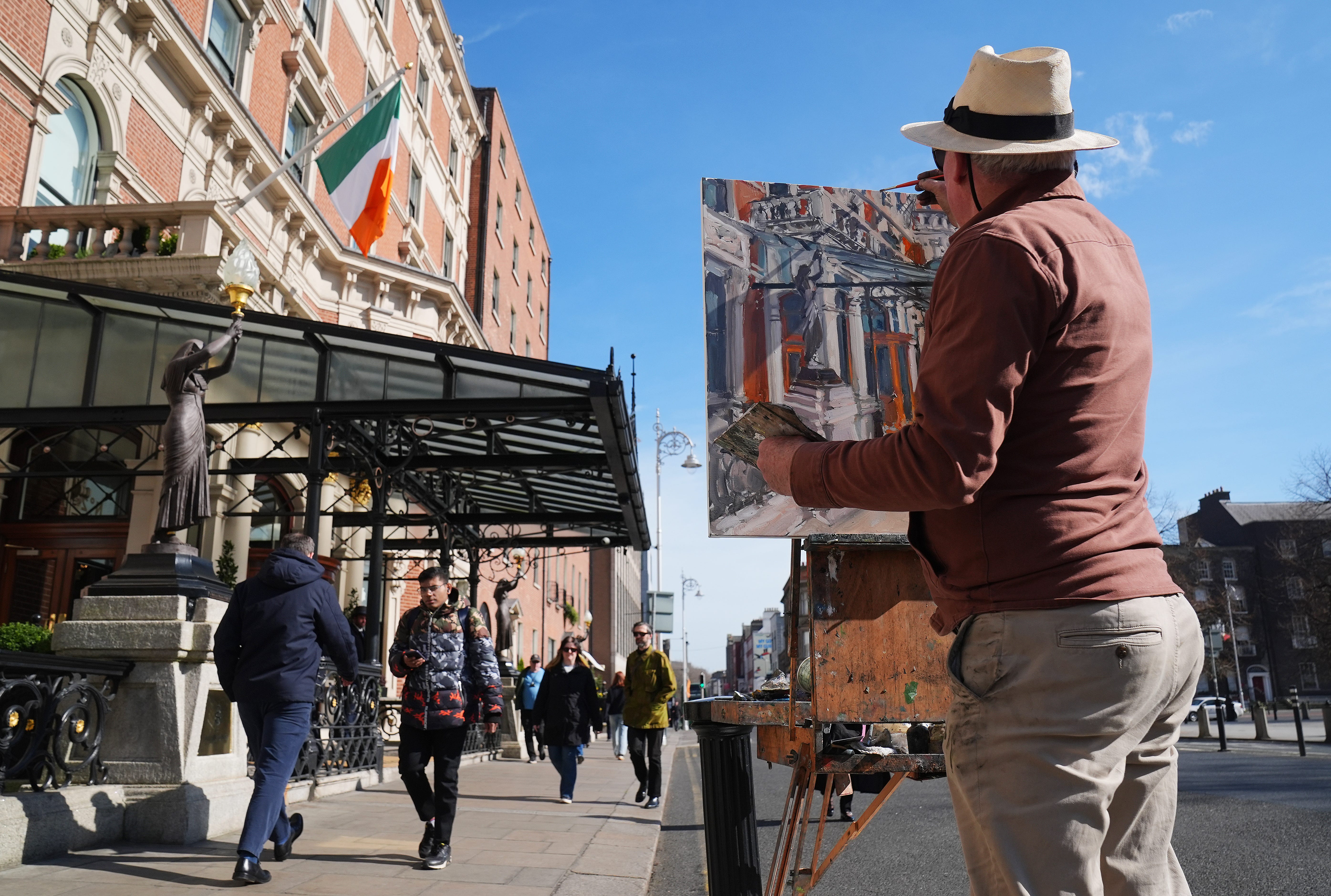 Artist Gerard Byrne working outside the Shelbourne Hotel in Dublin, Ireland, in March 2025.