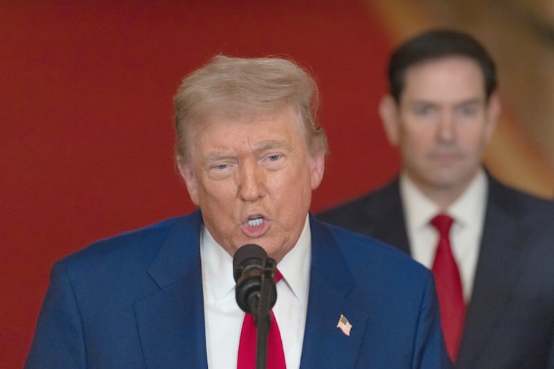 President Donald Trump delivers an address to the nation accompanied by U.S. Secretary of State Marco Rubio after striking Iran.