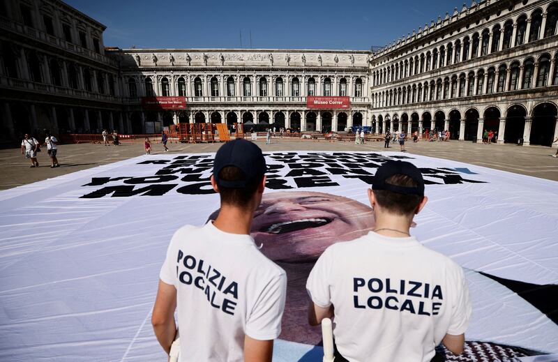 Anti-Bezos banner with local police looking on