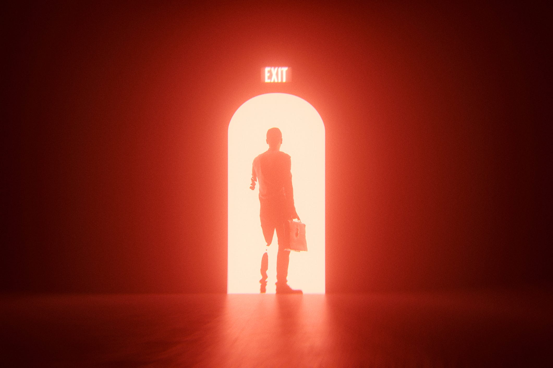 Business man leaving doorway red exit sign