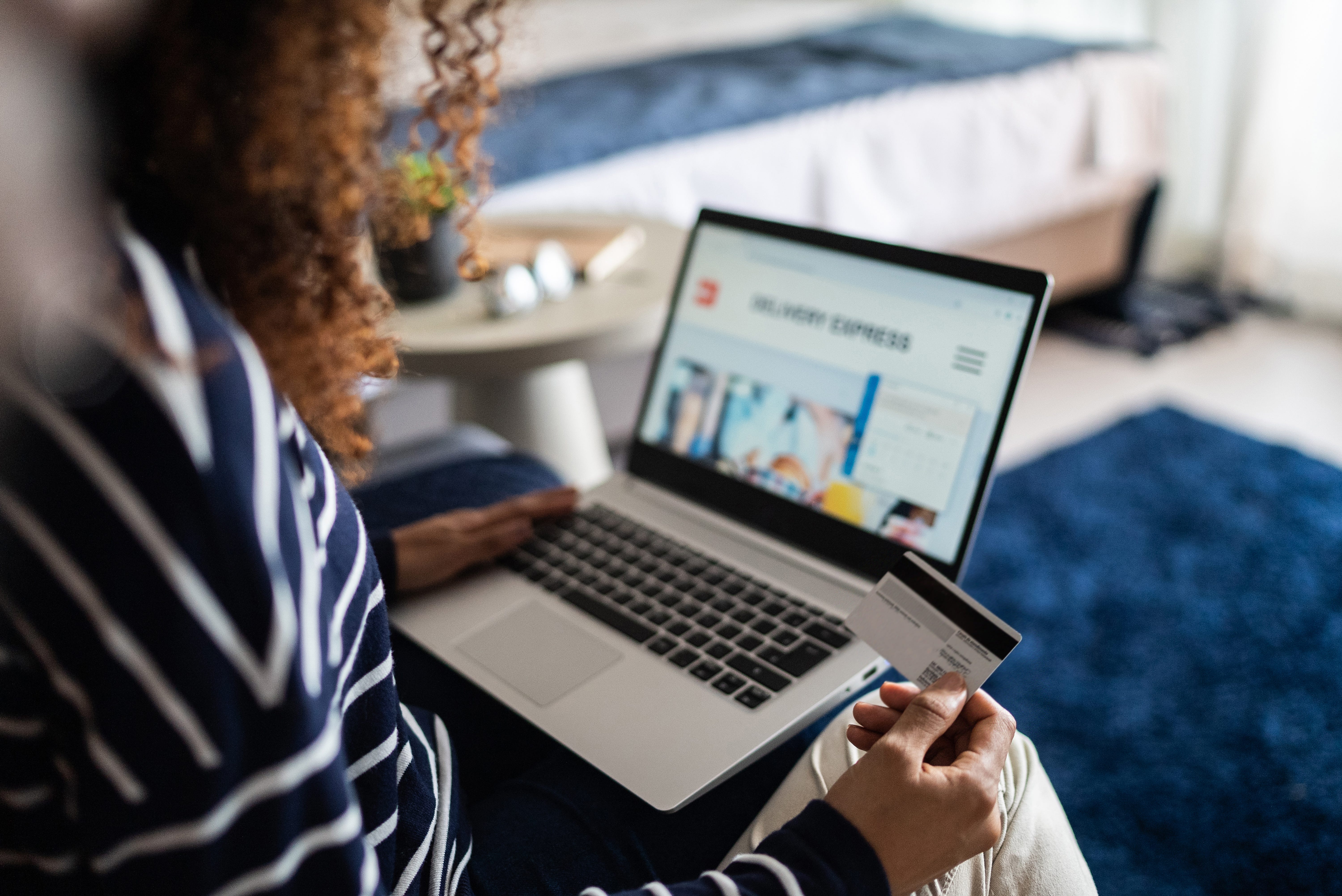 woman online shopping using the laptop at home