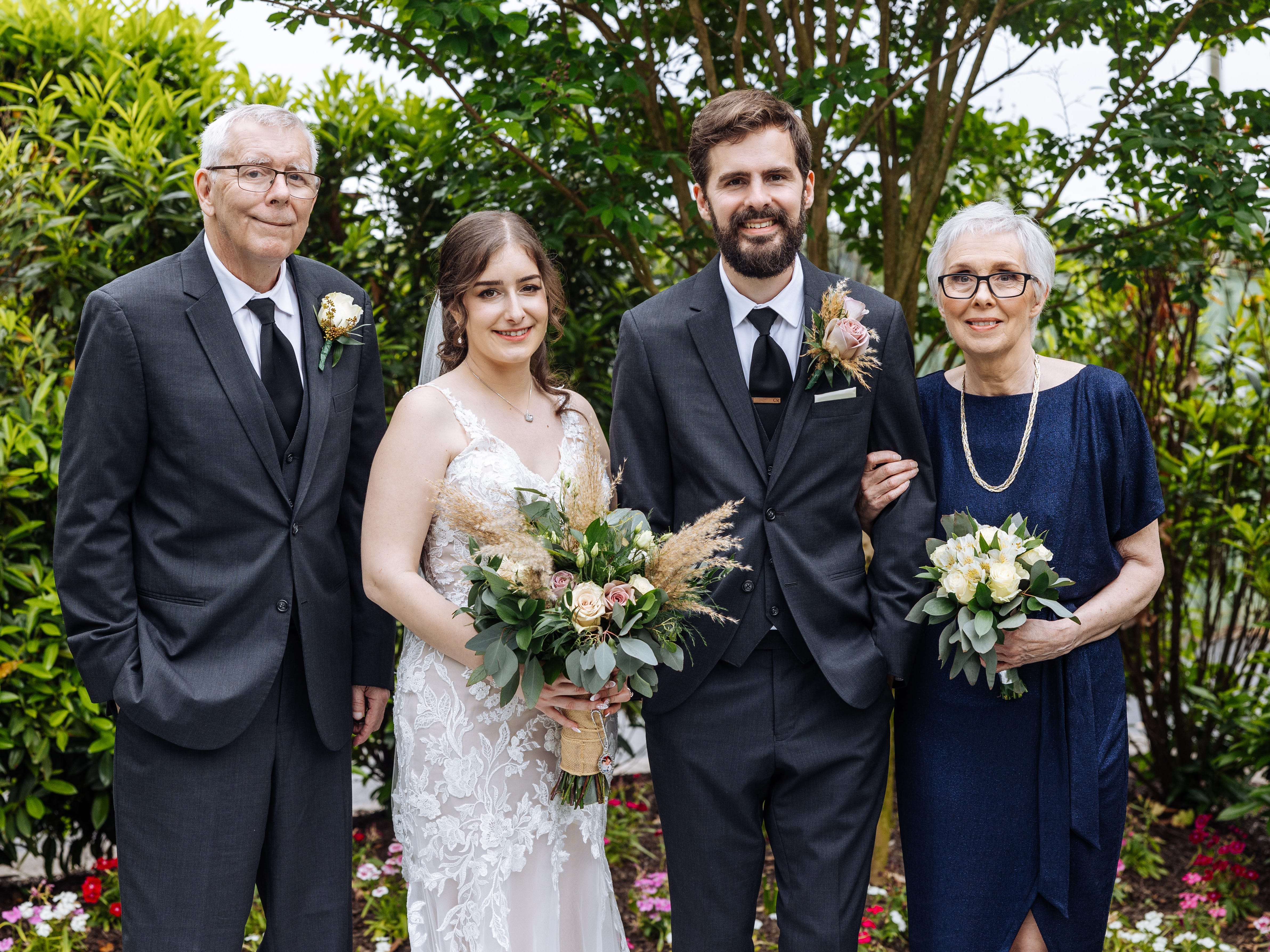 The author and her husband on their wedding day with her in-laws.