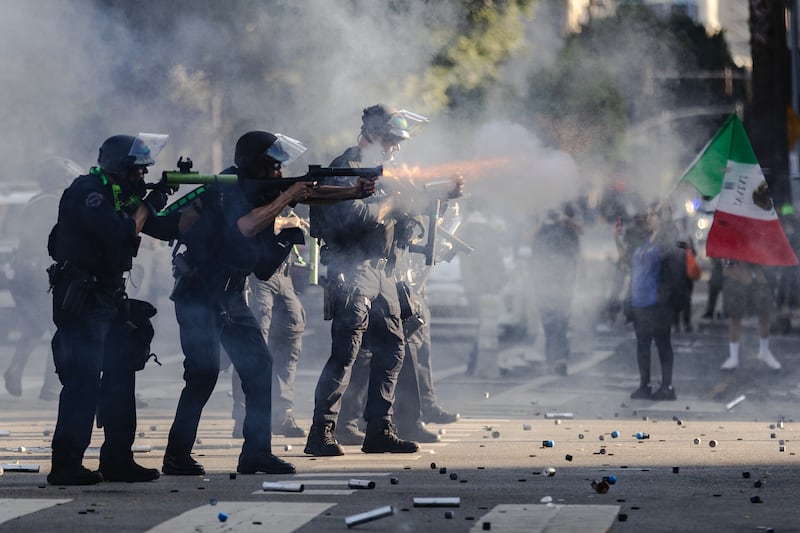 LOS ANGELES, CALIFORNIA - JUNE 8: Police fire less lethal projectiles during clashes between protesters and law enforcement on June 8, 2025 in Downtown Los Angeles, California. The clashes come after ICE raids swept throughout the city over the weekend. (Photo by Jim Vondruska/Getty Images)