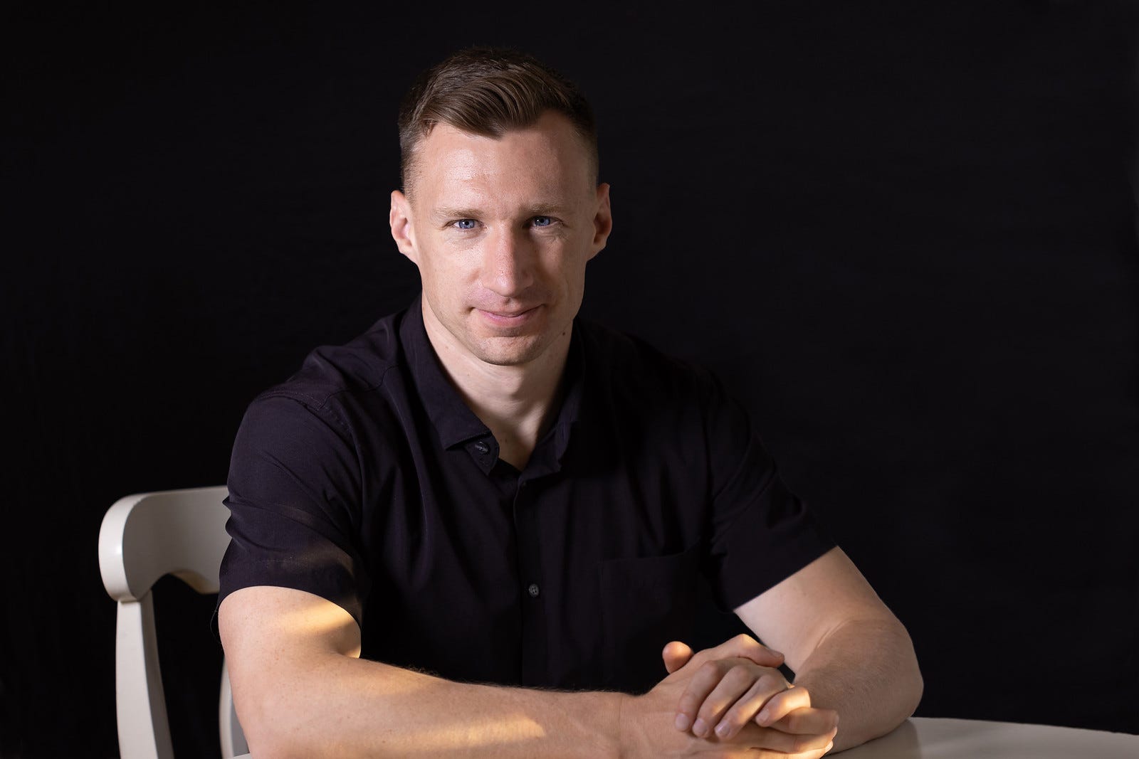 A headshot of Onebrief cofounder and CEO, Grant Demareee