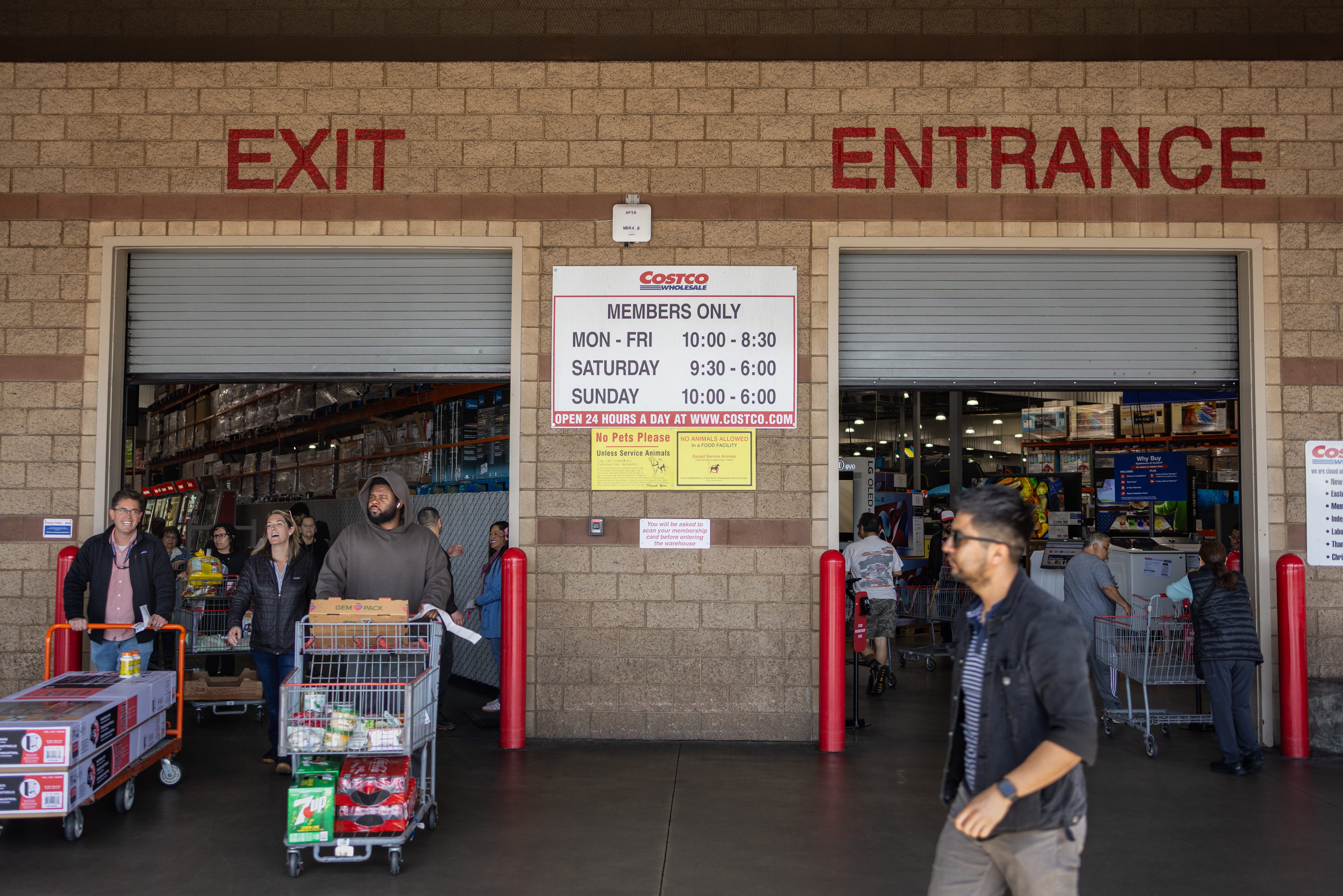People at the entrance and exit of a Costco warehouse on April 4, 2025, in Hawthorne, California.