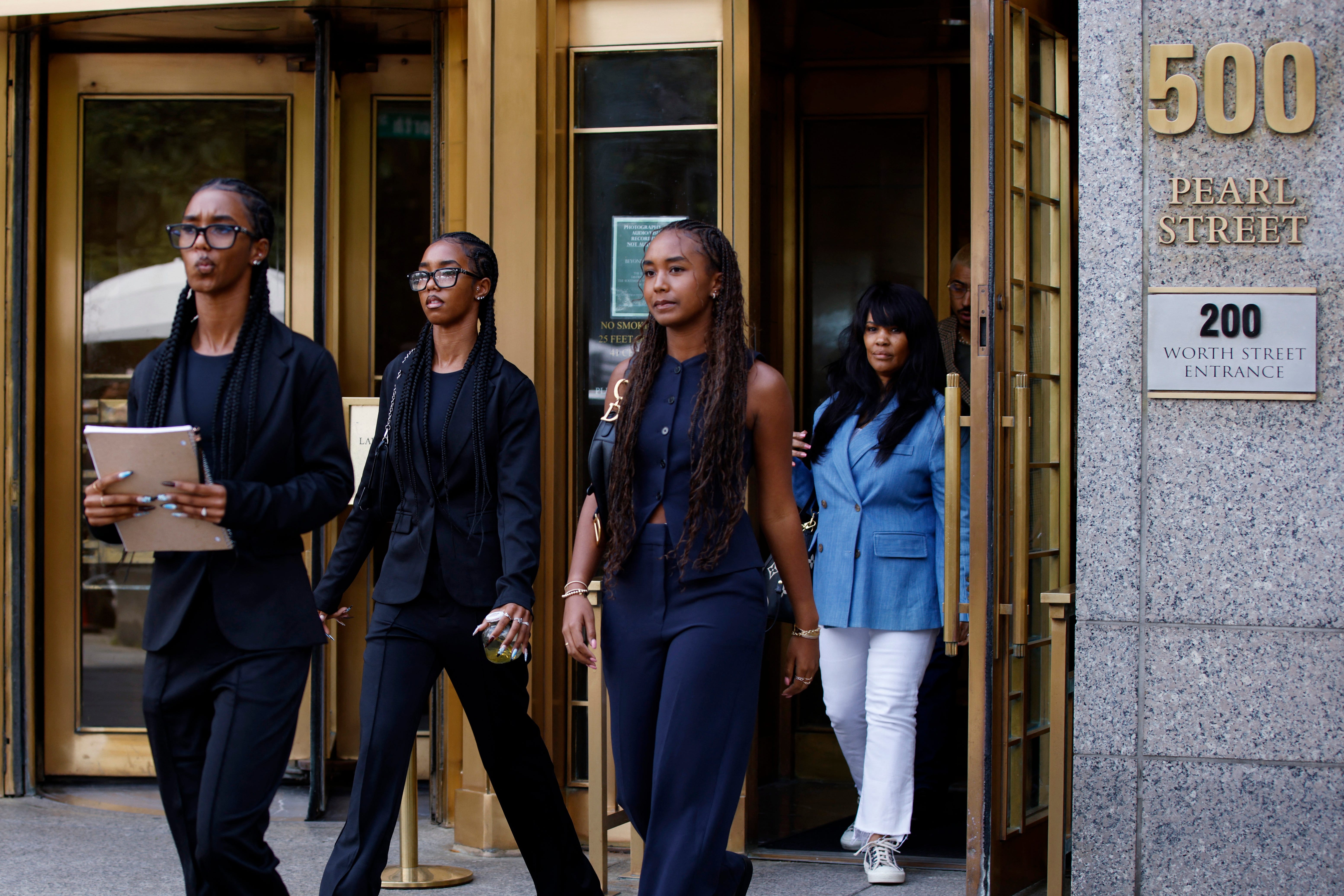 Sean Combs' three daughters leave federal court in Manhattan after praying with their father in court at the start of deliberations.