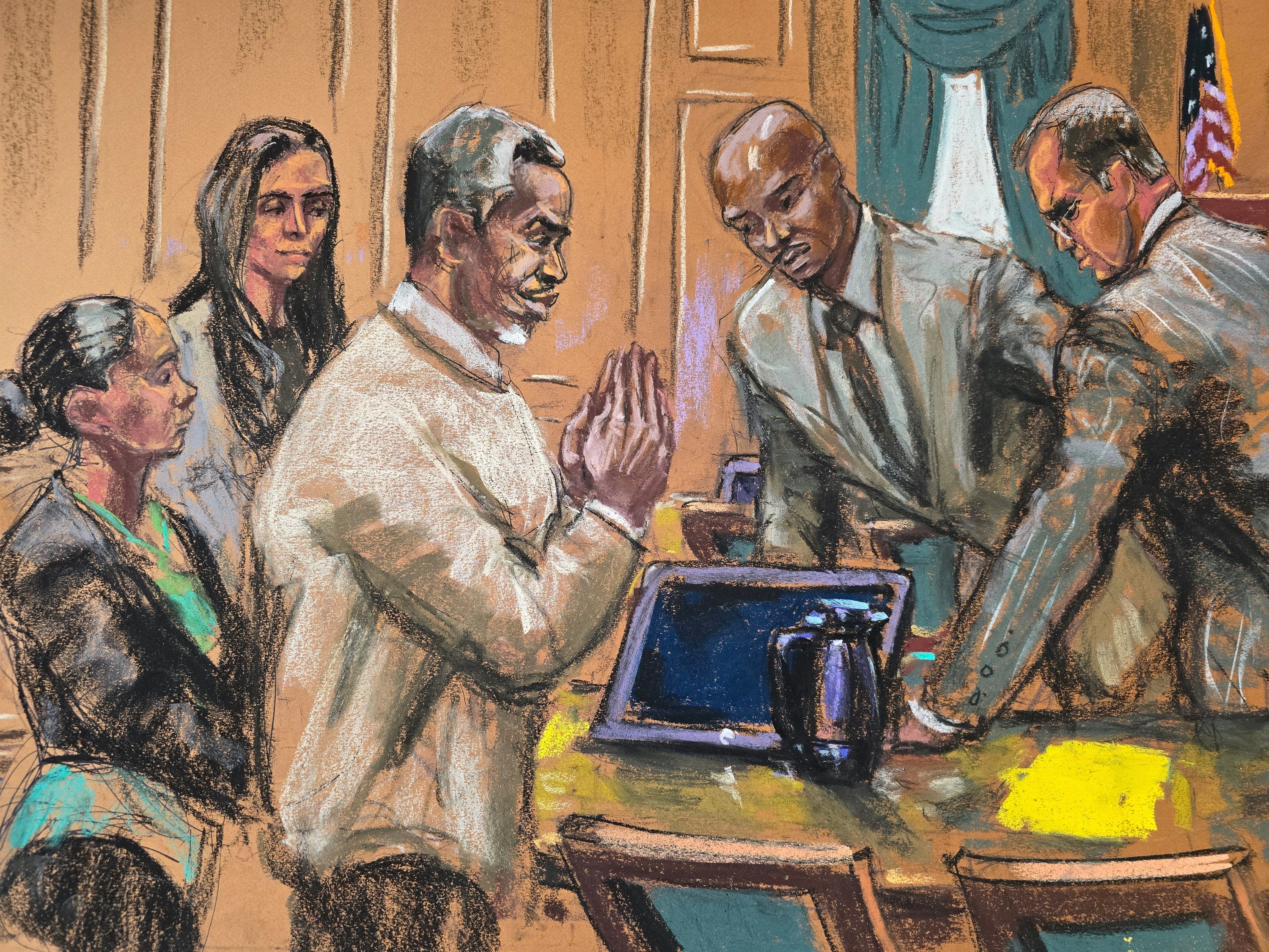 A courtroom sketch of Sean Combs with his attorneys.