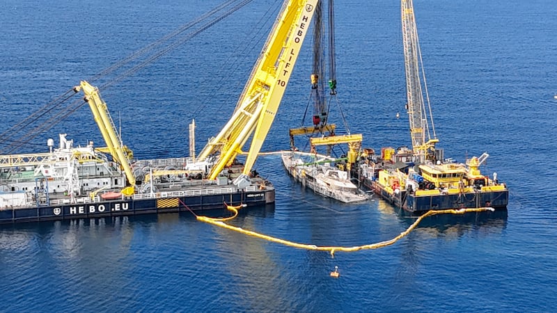 A drone view shows floating crane ships HEBO LIFT 10 and HEBO LIFT 2 recovering the "Bayesian" yacht of British tech entrepreneur Mike Lynch, who died when the yacht sank off Porticello, near Palermo, Sicily, Italy, June 20, 2025. REUTERS/Danilo Arnone
