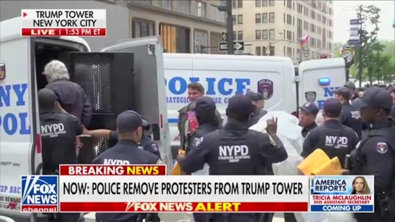Protesters opposing Immigration and Customs Enforcement were removed from the Trump Tower lobby Monday afternoon.