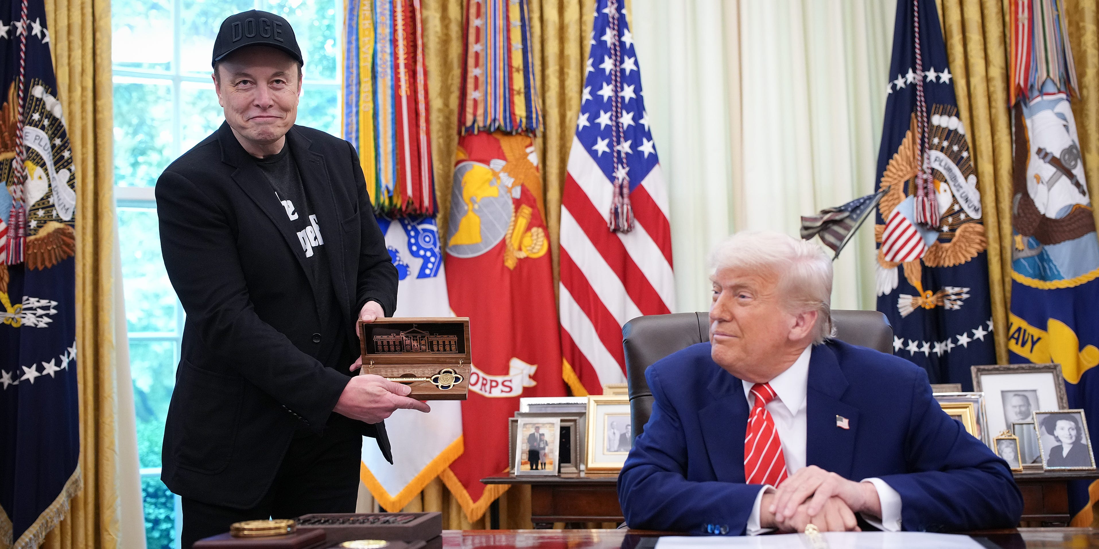 President Donald Trump gifts Elon Musk a key during a White House event on May 30, 2025.