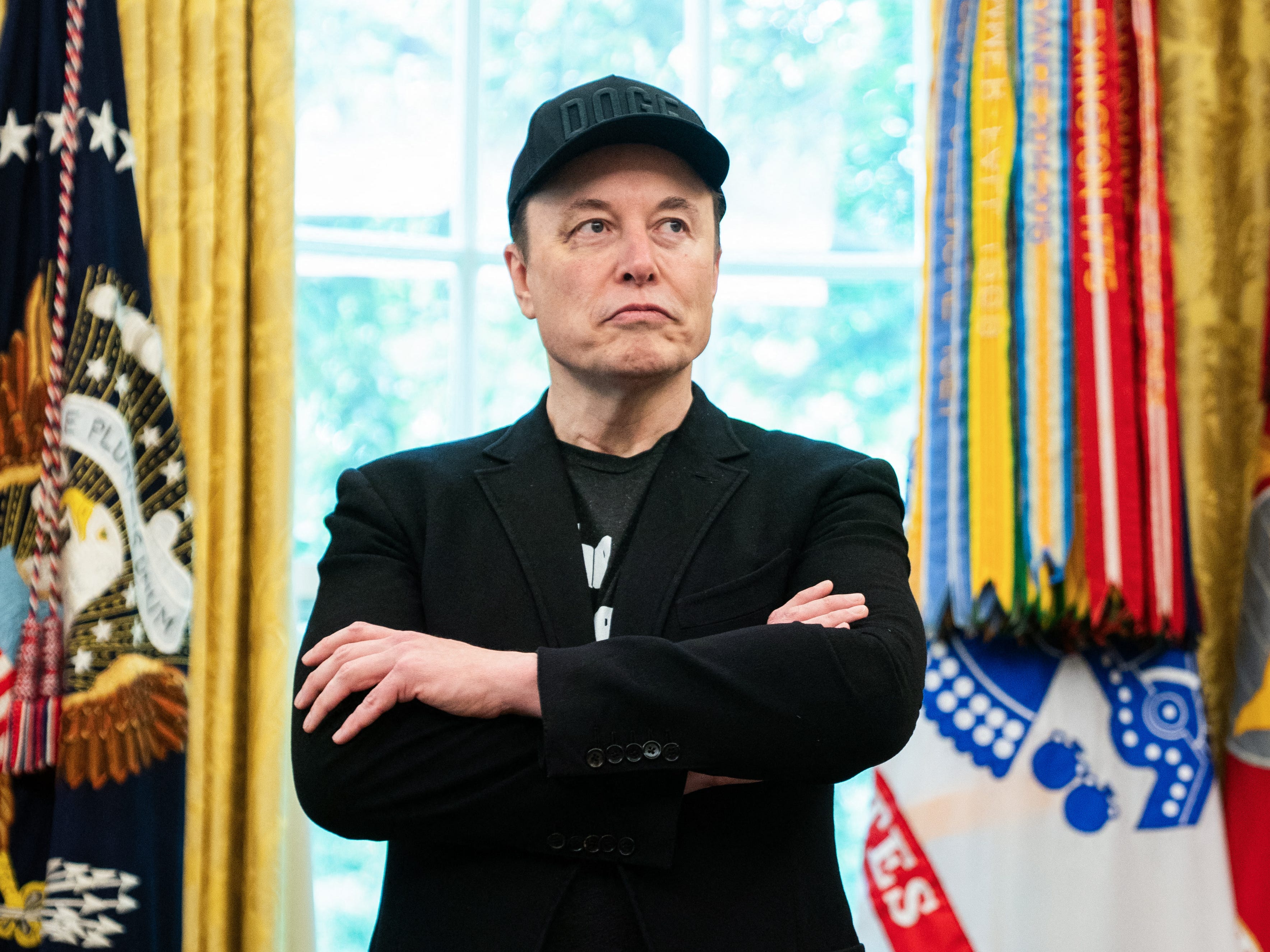 Elon Musk standing in White House