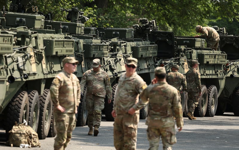 Soldiers tend to Stryker armored vehicles ahead of the upcoming U.S. Army 250th anniversary celebration parade in Washington, D.C., U.S., June 11, 2025. REUTERS/Kevin Lamarque