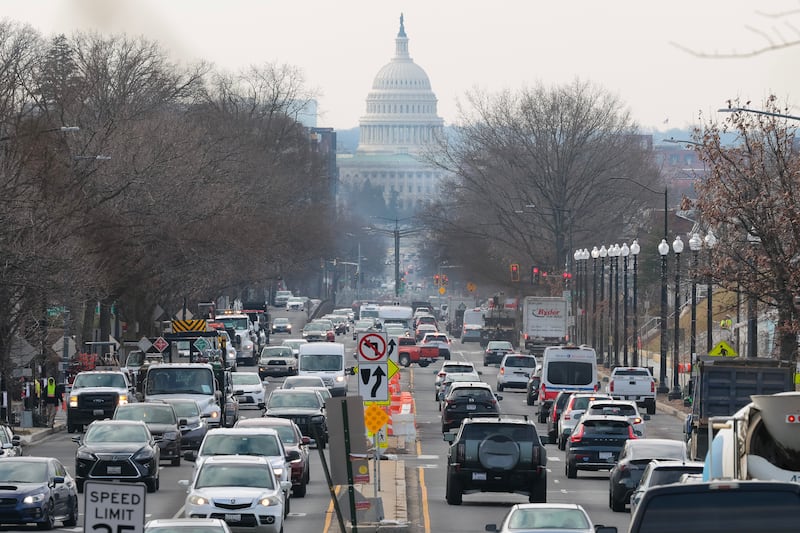 WASHINGTON, DC - FEBRUARY 10: Cars drive during morning rush hour traffic U.S. President Donald Trump's return to work order begins on February 10, 2025 in Washington, DC. Effective today, Trump's order ends remote work and mandates that employees resume working in person at their assigned duty stations. (Photo by Kayla Bartkowski/Getty Images)