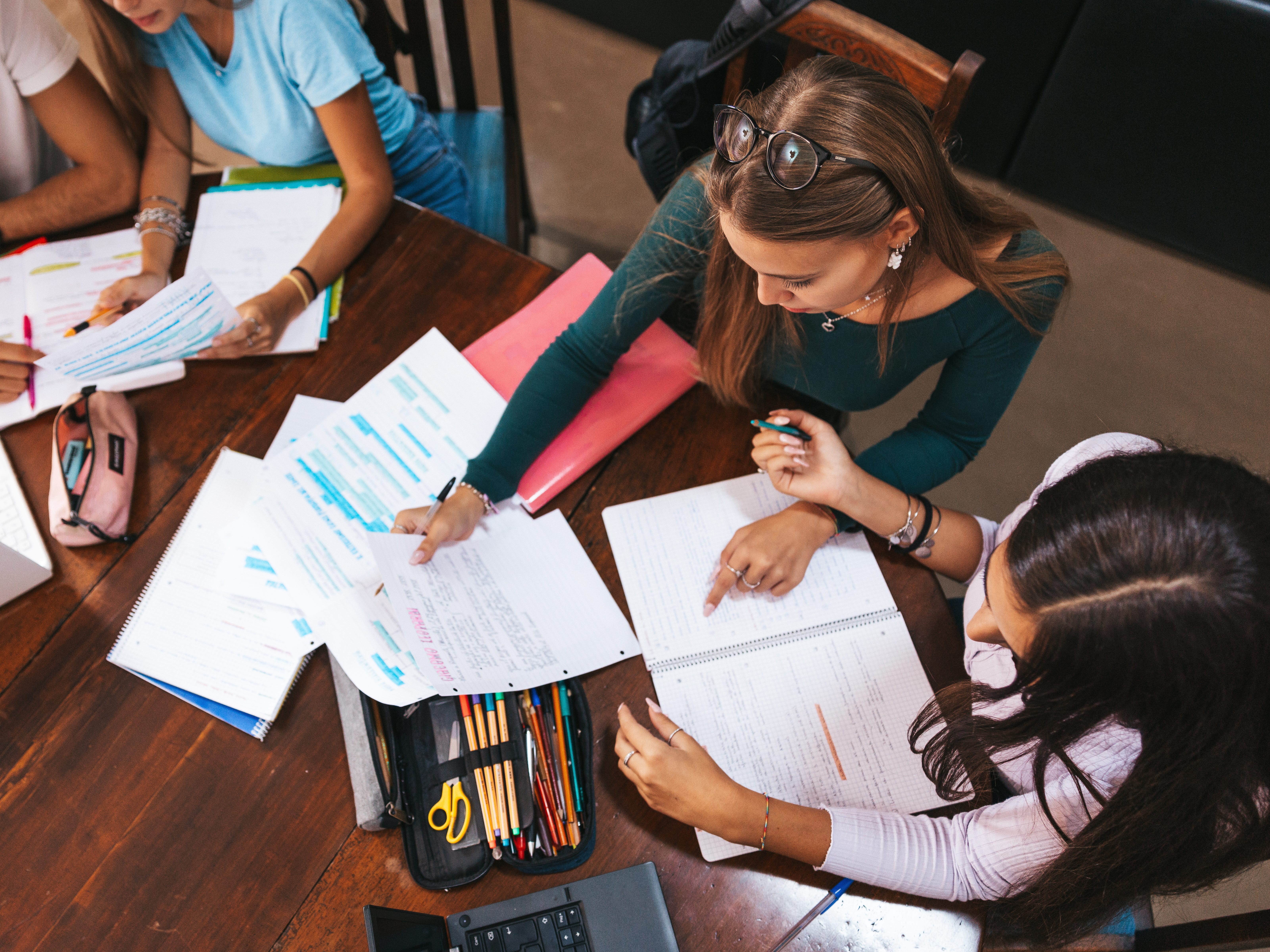 Students collaborating at a table.