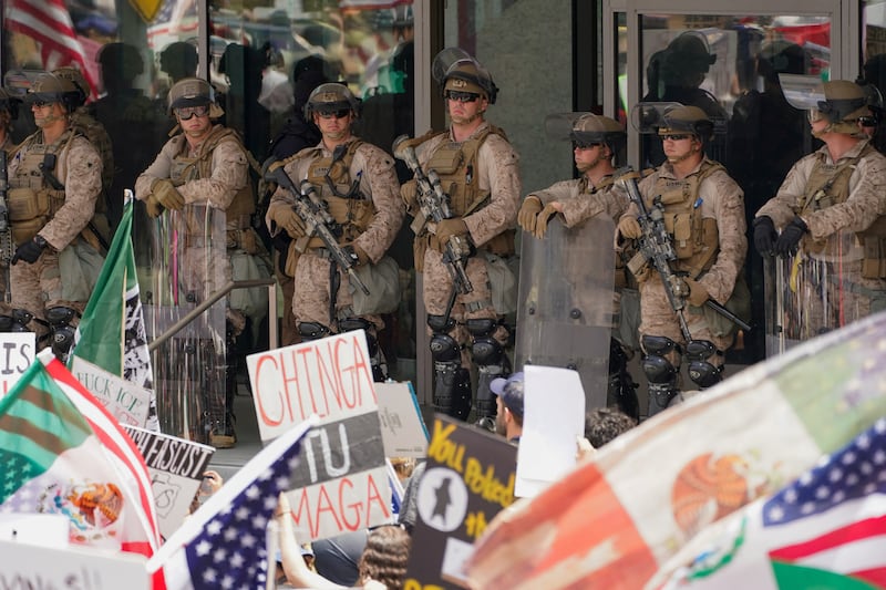U.S. Marines guard a federal building amid anti-ICE demonstrations in Los Angeles.