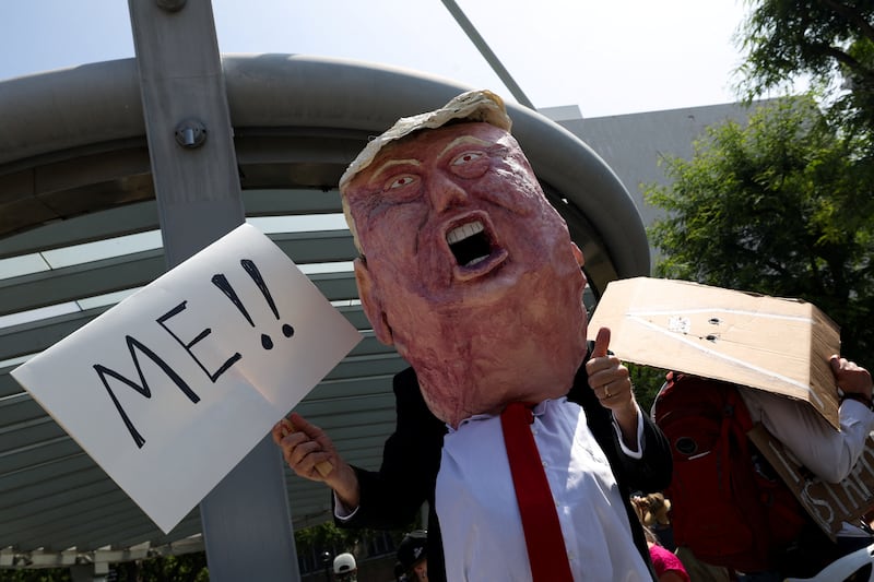 A demonstrator wears a costume during a protest against U.S. President Donald Trump's policies, in Los Angeles, California, U.S., June 14, 2025.
