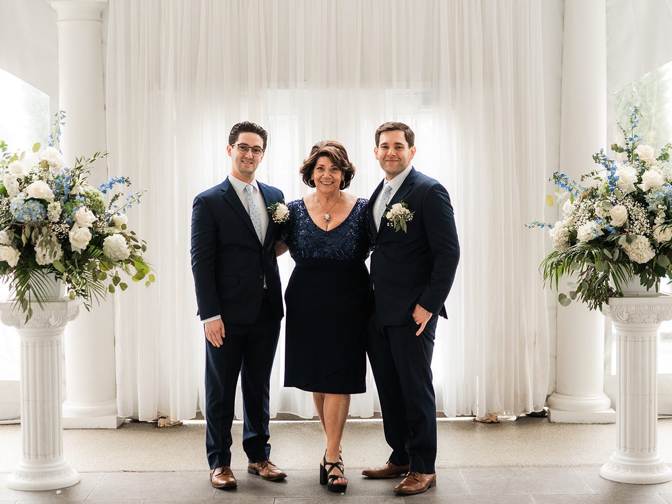 Rochelle Nataloni at a same-sex wedding with the two grooms