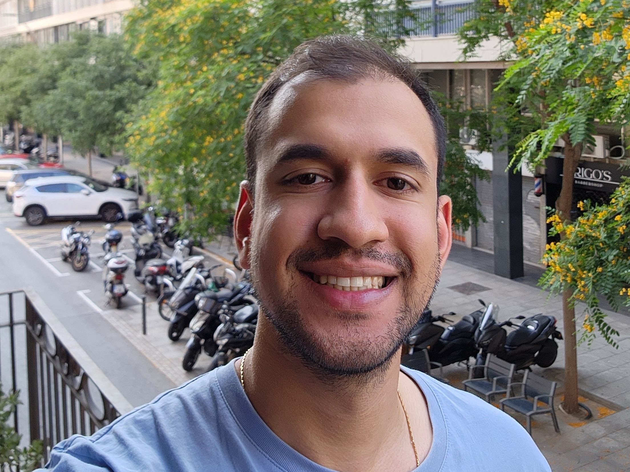 Selfie photos of man wearing a blue shirt.