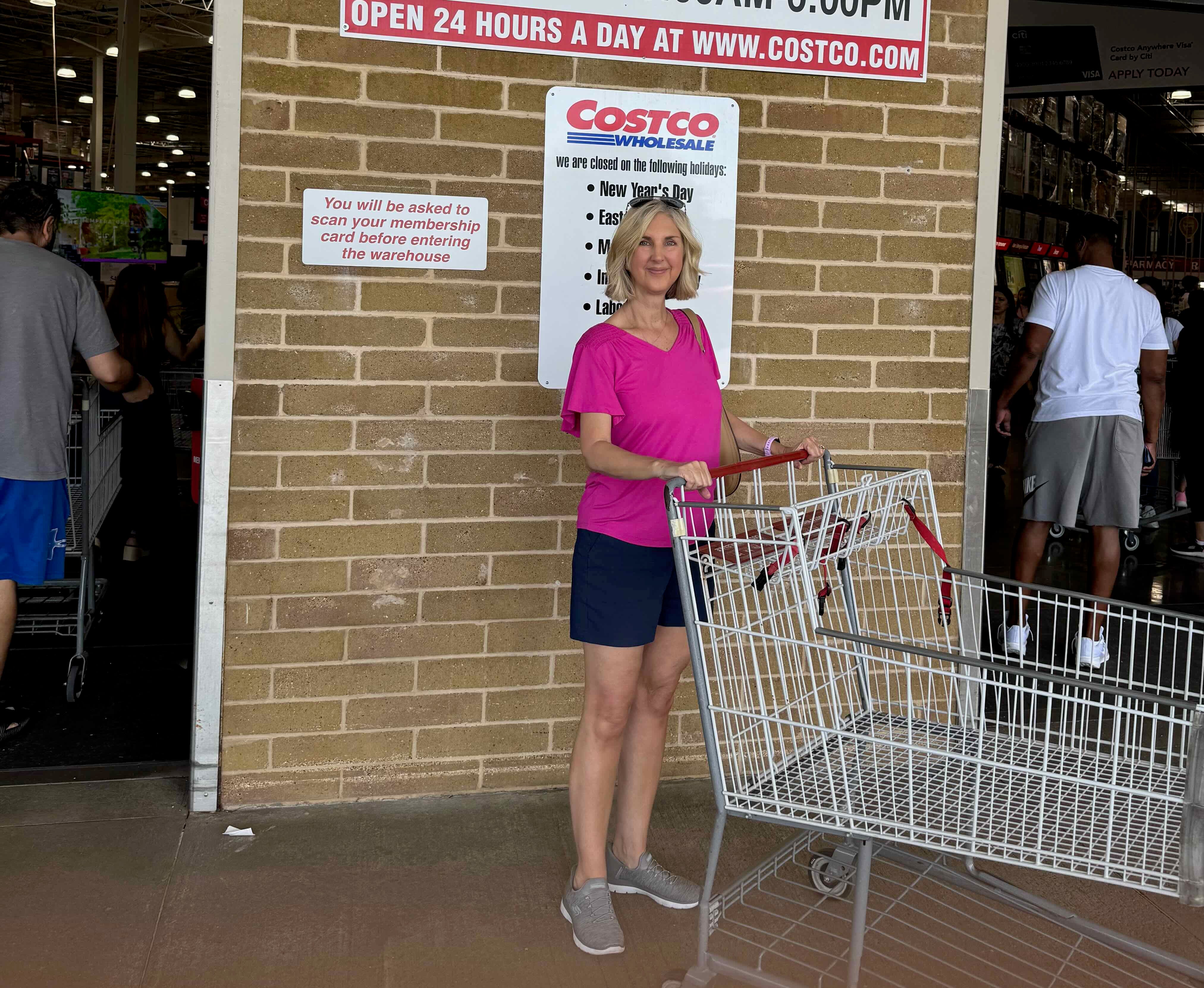 Woman posing in front of Costco.