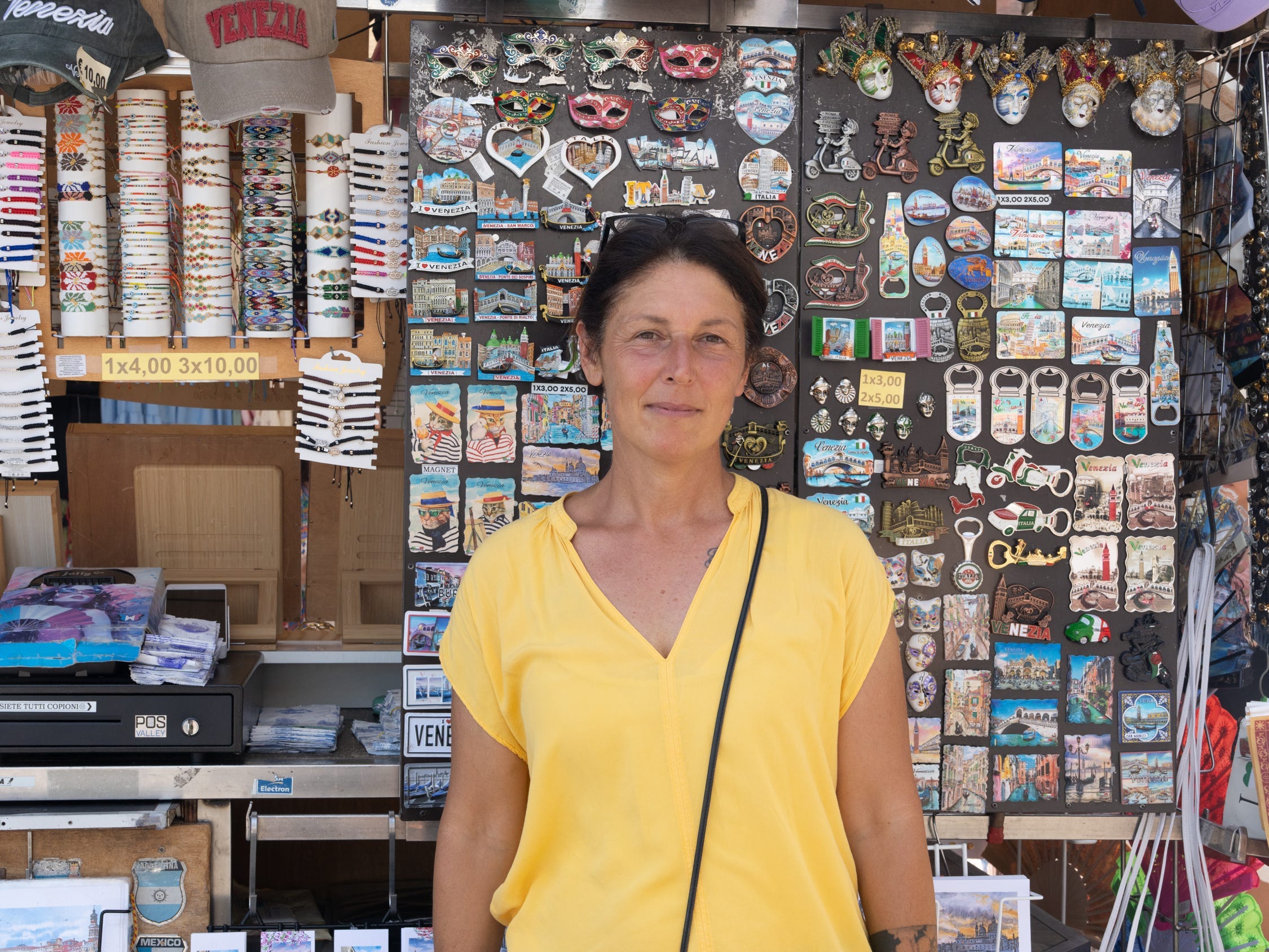 Jessica Testoni, standing near a souvenir shop, has always lived in Venice, Italy.
