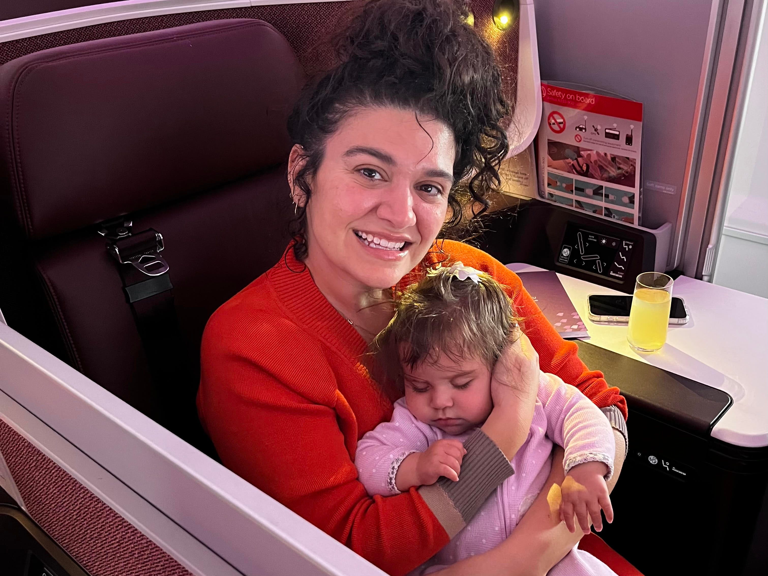 Mary Kay McBrayer with her infant on a plane