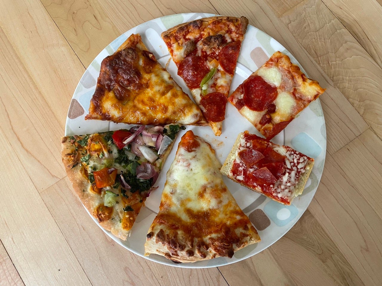 Plate with six slices of pizza on it