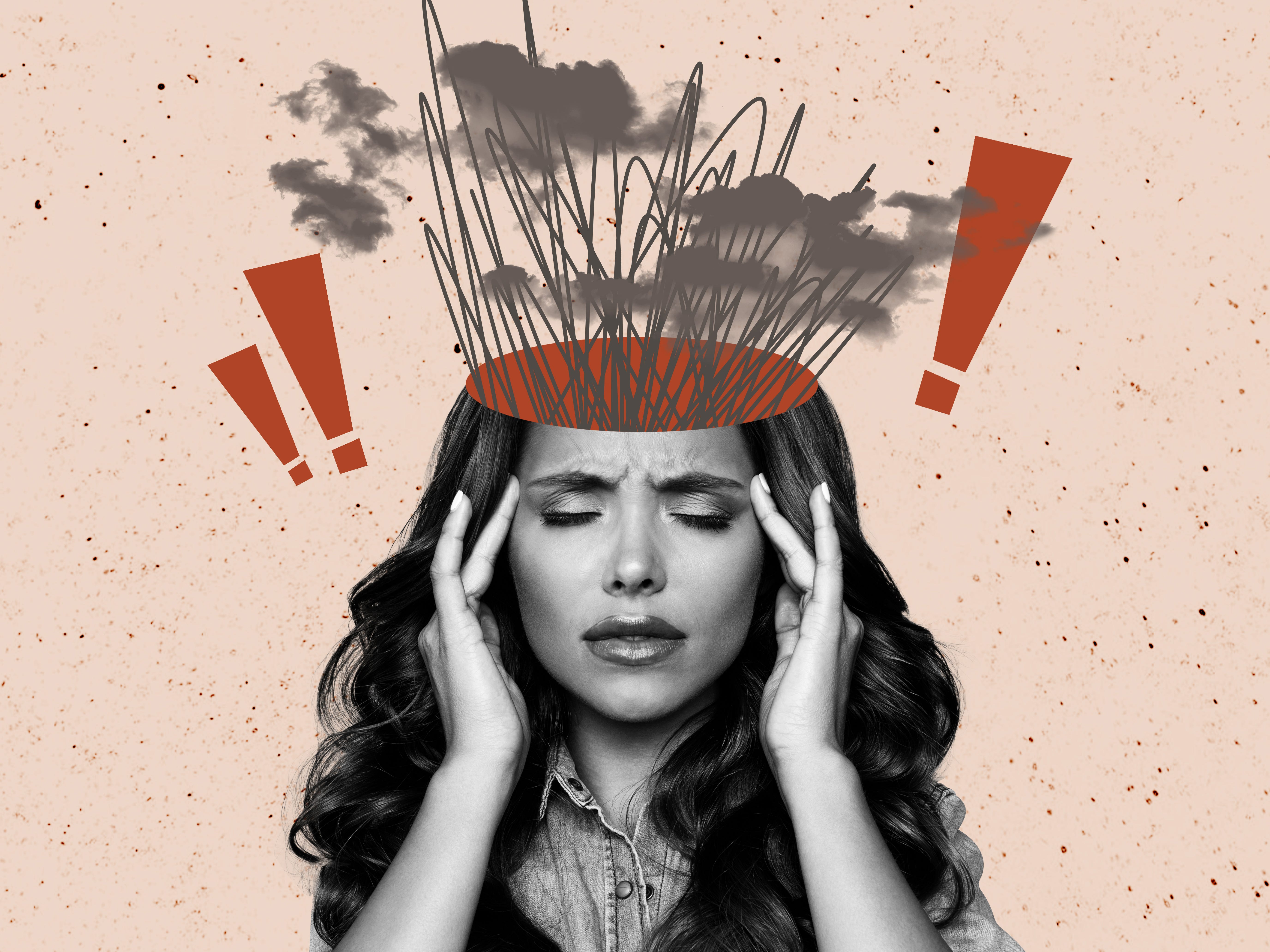 A female employee touches her temples with eyes closed