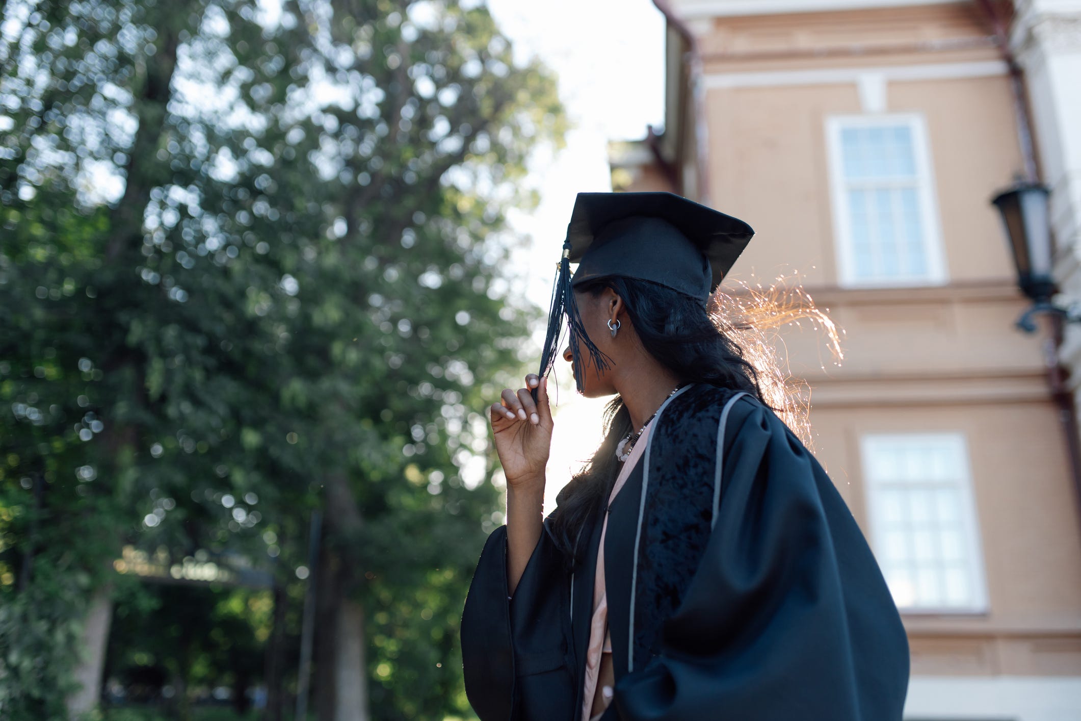 Gen Zer in a cap and gown