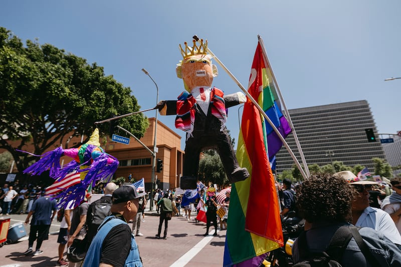 Protesters display an effigy of Donald Trump wearing a crown during the "No Kings" protest in Los Angeles.