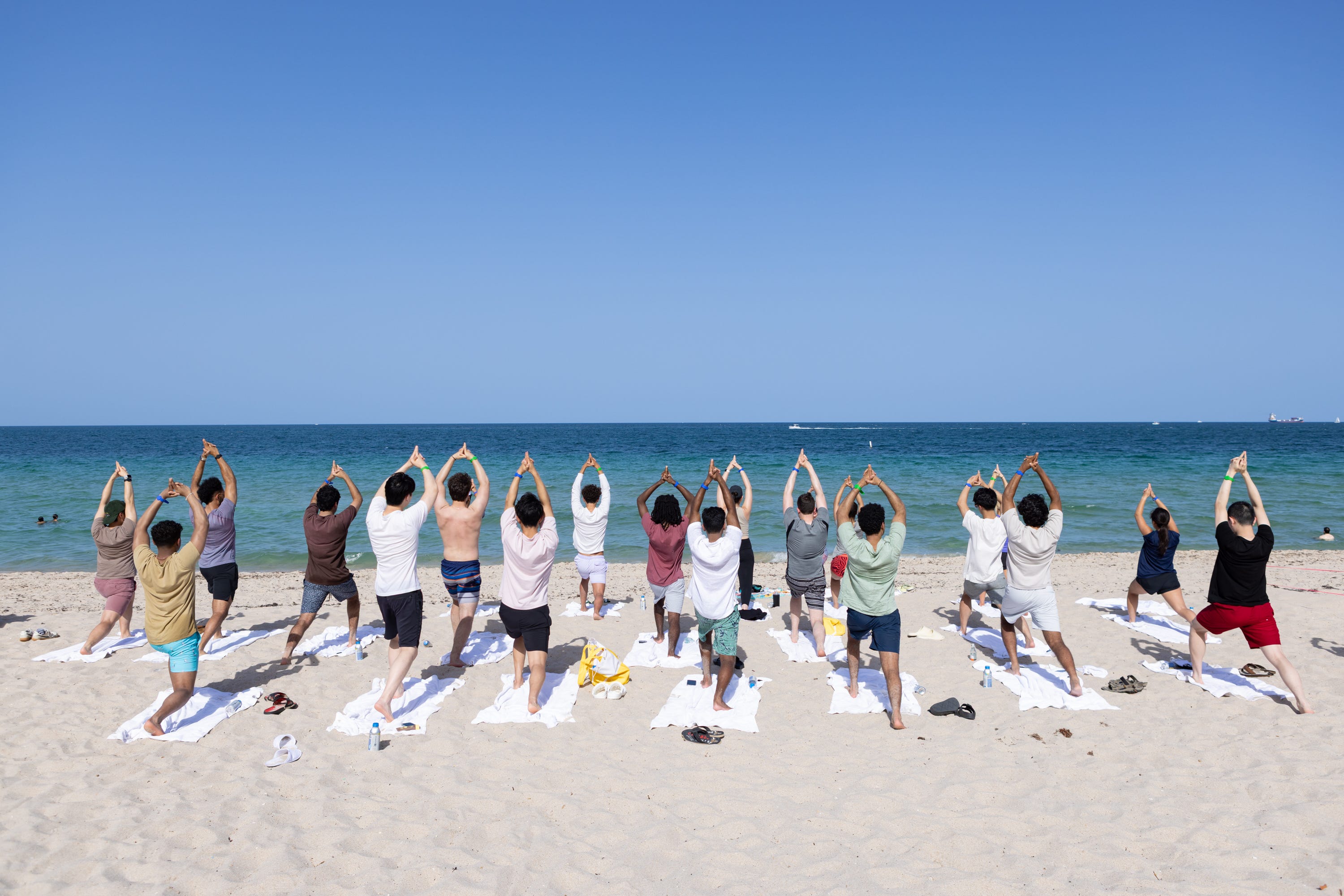 Citadel interns participate in a beach yoga class at their off-site trip in Fort Lauderdale, Florida.