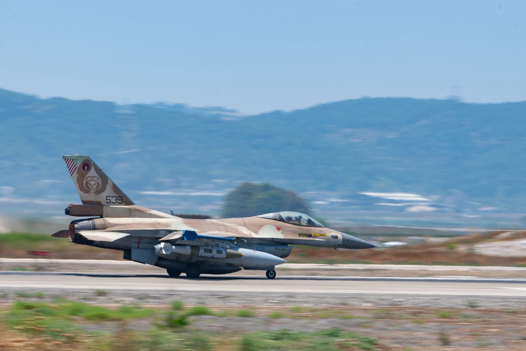An Israeli F-16 fighter jet is seen carrying a cheap glide bomb in this June 16, 2025, image.