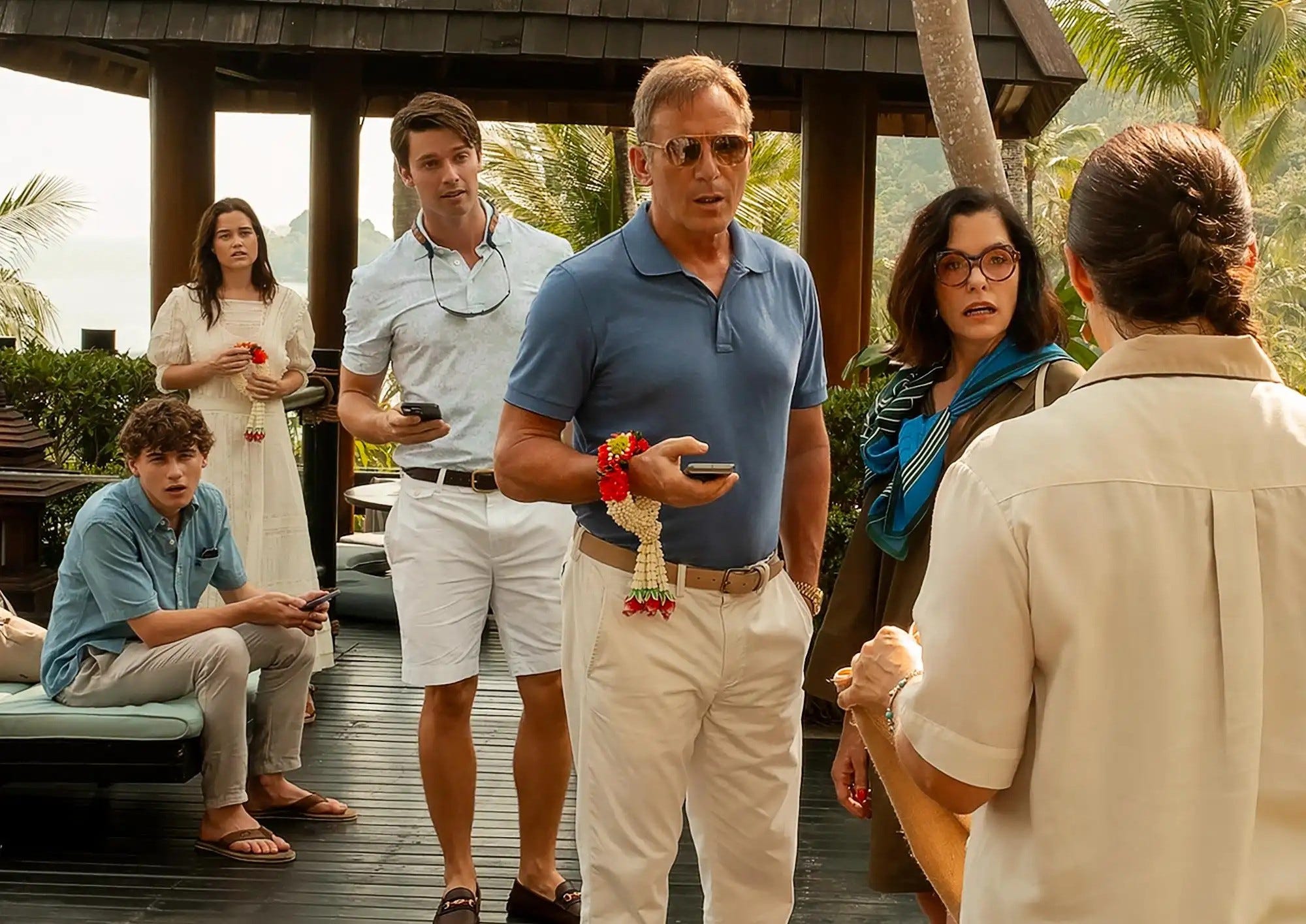The White Lotus cast holsing their phones