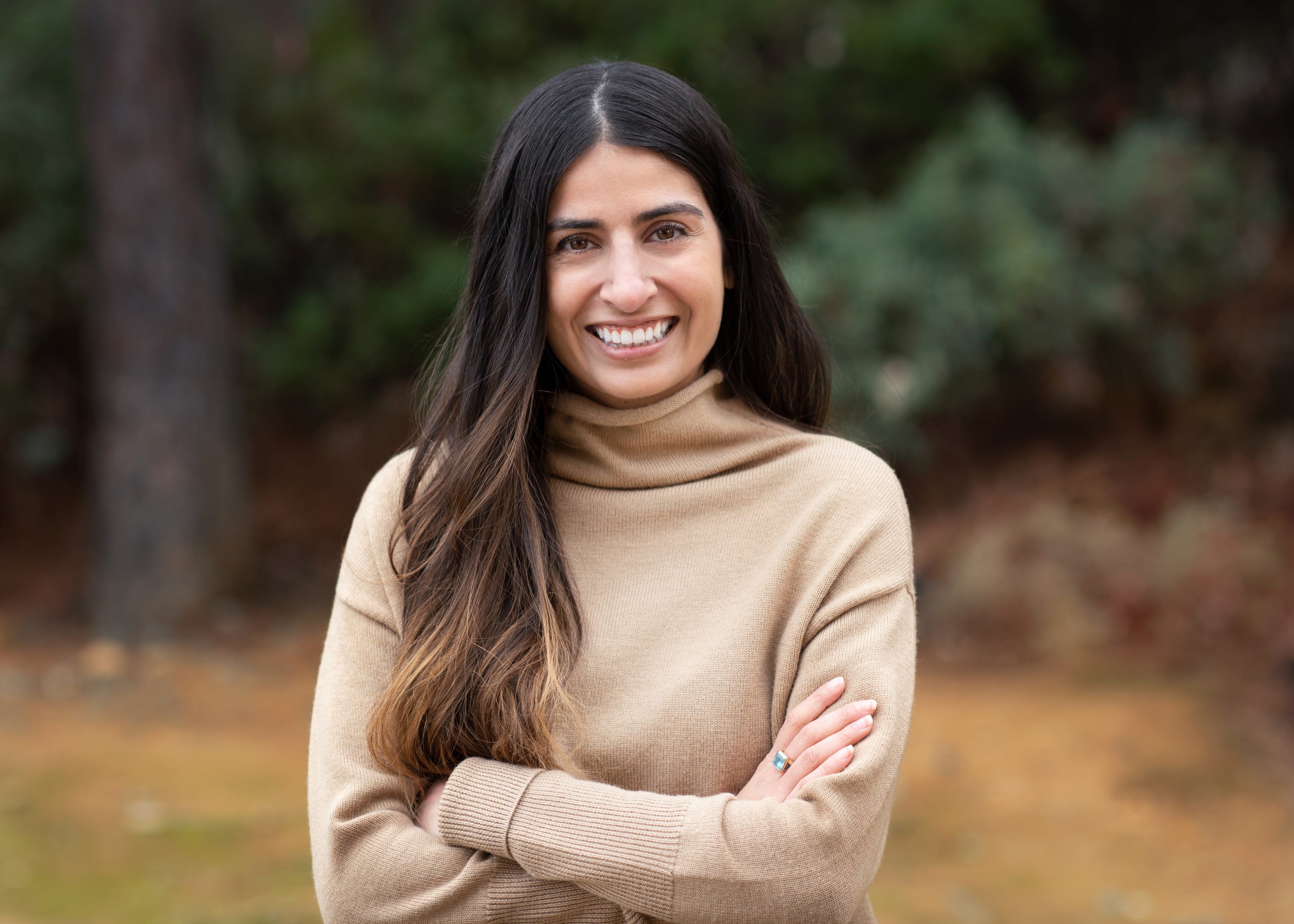 Asha Sharma, chief operating officer at Instacart, poses against a forest background