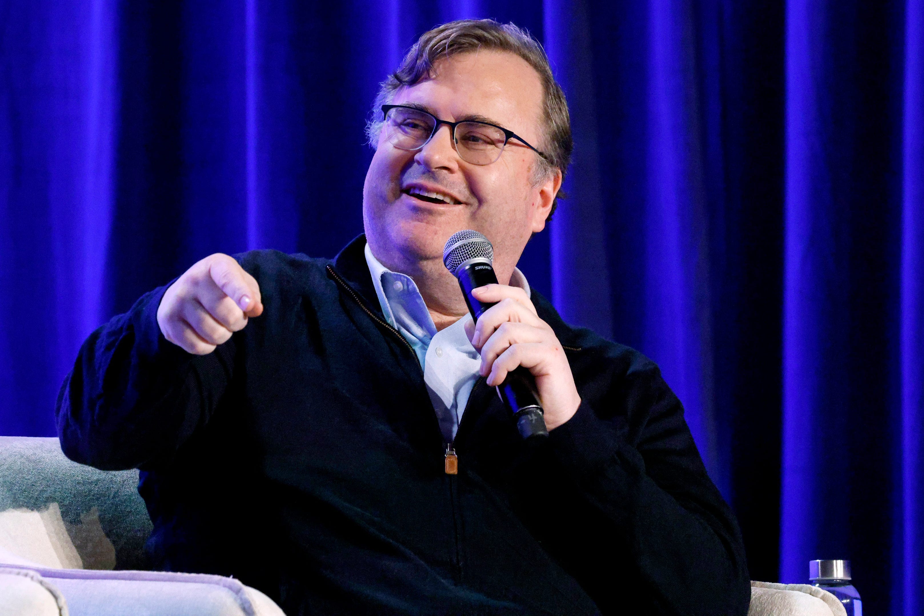 Reid Hoffman speaking onstage at a conference in San Francisco, California.