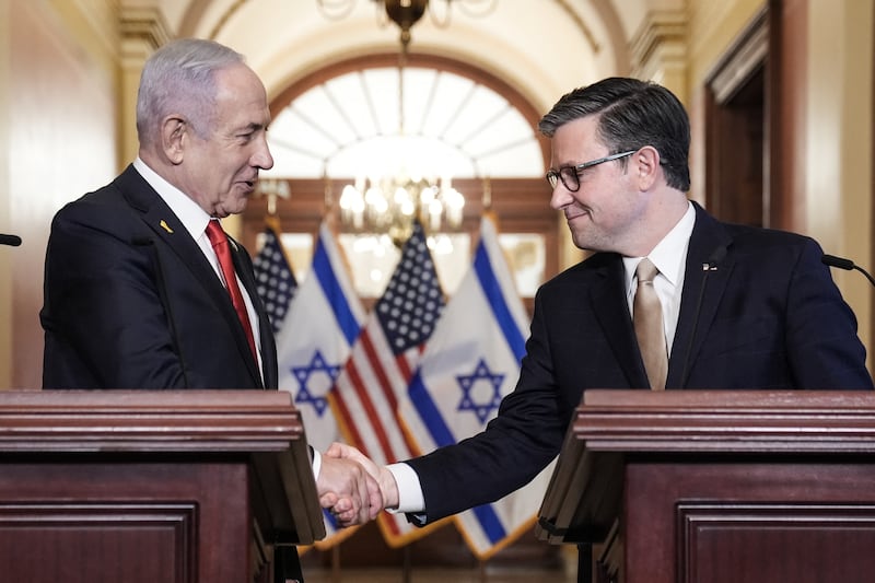 Speaker Mike Johnson shakes hands with Israeli Prime Minister Benjamin Netanyahu as they speak to the press at the U.S. Capitol on February 7, 2025.