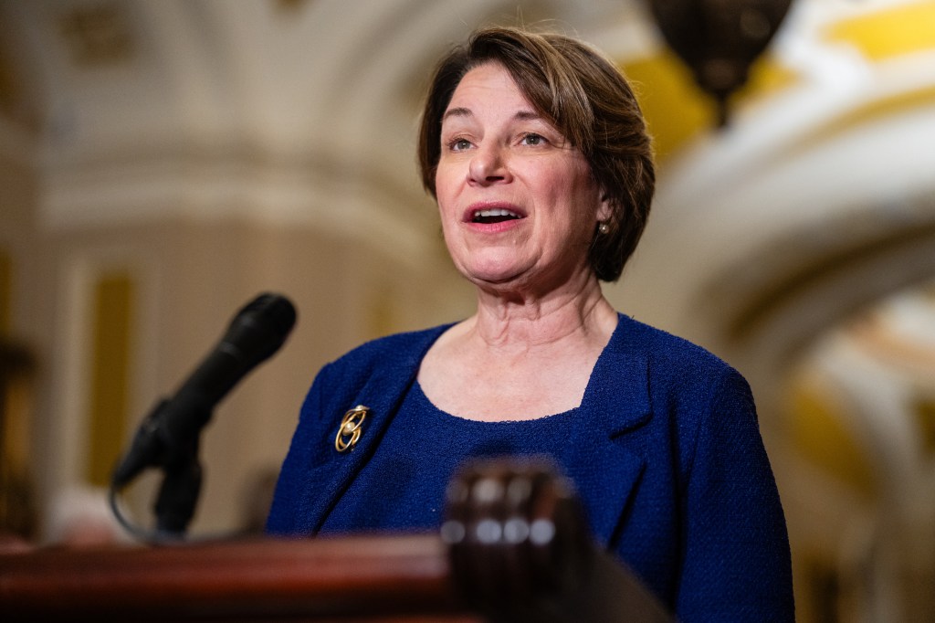 Senator Amy Klobuchar speaking at a news conference.