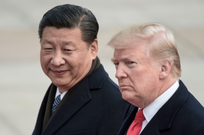 China's President Xi Jinping (L) and US President Donald Trump attend a welcome ceremony at the Great Hall of the People in Beijing.