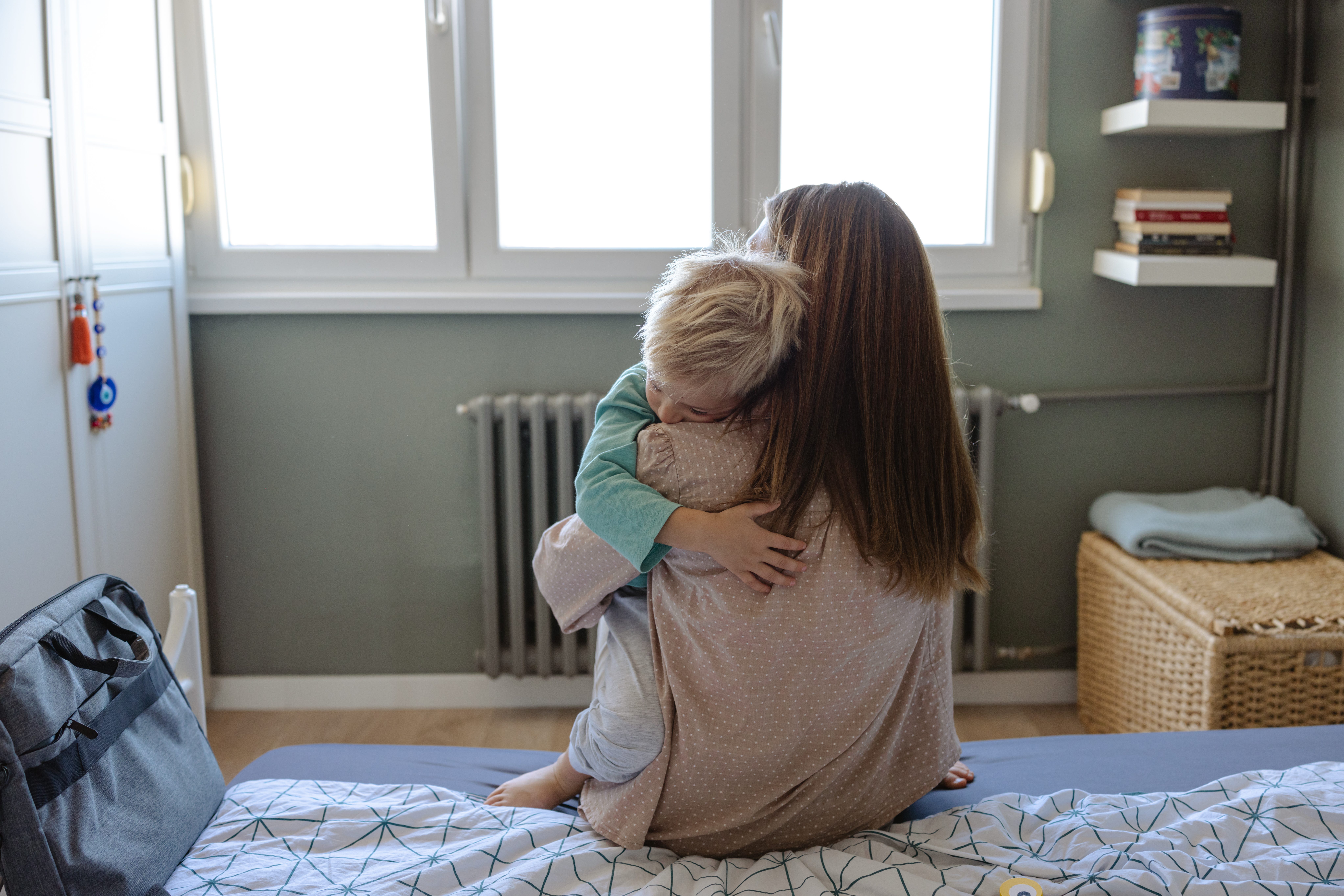 Mom hugs his son