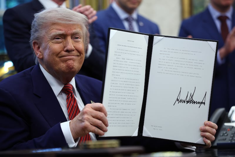 Trump holding a signed executive order—he demanded action on the Smithsonian’s allegedly “improper” ideology in March.