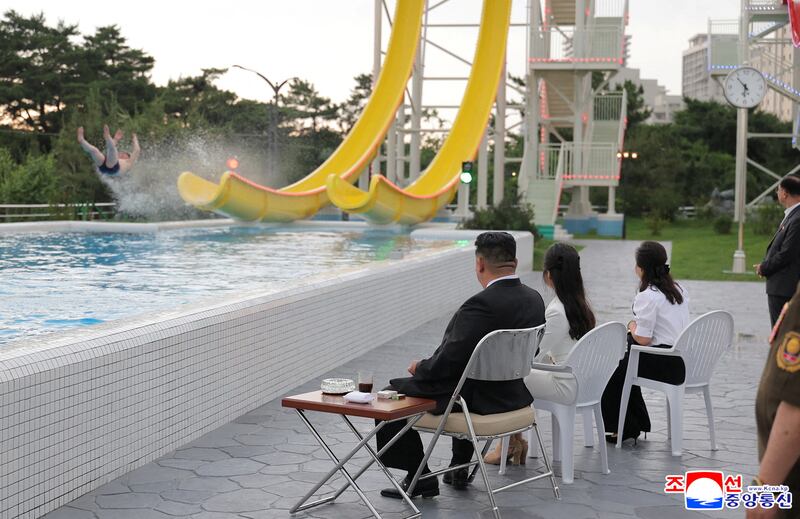 North Korean leader Kim Jong Un and his daughter Kim Ju Ae watch a person sliding down a slide during a ceremony to celebrate the completion of the Wonsan Kalma Coastal Tourist Zone, in Wonsan, North Korea, June 24, 2025.  KCNA via REUTERS    ATTENTION EDITORS - THIS IMAGE WAS PROVIDED BY A THIRD PARTY. REUTERS IS UNABLE TO INDEPENDENTLY VERIFY THIS IMAGE. NO THIRD PARTY SALES. SOUTH KOREA OUT. NO COMMERCIAL OR EDITORIAL SALES IN SOUTH KOREA.